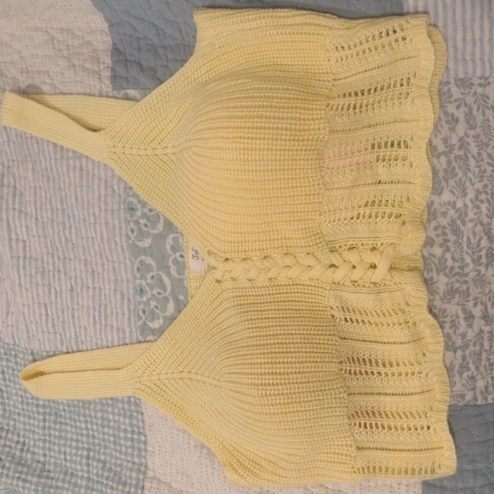 A yellow, knitted crop top